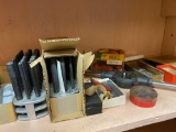 Shelf load of assorted tooling and new 16in chainsaw blade and grease zerks