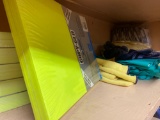 Shelf load of work gloves and fluorescent copy paper