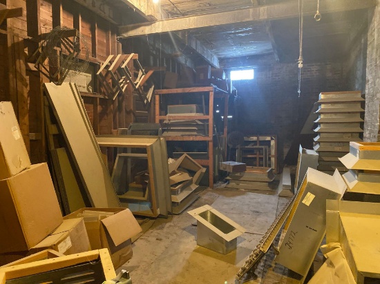 Room full of roof vents, materials, conveyor and tool box