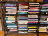 Two bookshelves filled with books - most in mint condition