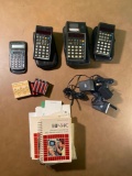 4 Scientific Calculators w/ 3 battery packs, cords, and manuals