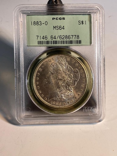 1883O Morgan Silver Dollar, graded MS64 by PCGS, vintage holder