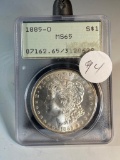1885O Morgan Silver Dollar graded MS65 by PCGS, vintage holder