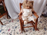 Antique Doll in Small Wooden Rocking Chair with Additional Outfit