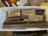 Large tote of assorted current O-Scale track