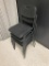 LOT OF 4 BLACK PLASTIC STACKABLE CHAIRS