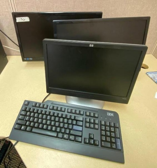 2 AOC LED 21" Monitors, One HP 17" Monitor, and One Keyboard