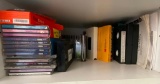 Shelf of Misc DVDs and VHS Tapes