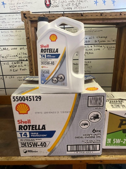 Opened box of (4) 1 gal 15w-40 Shell Rotella motor oil