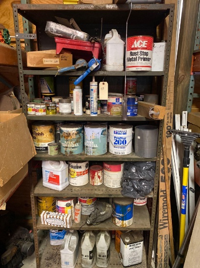 Shelf load of paint, stain, caulk guns and thinners