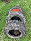 Set of (3) Bobcat Tires. One with rim.