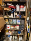 Shelf load of paint, stain, caulk guns and thinners