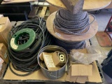 A pallet of metal conduit, fish tape, hardware, and more