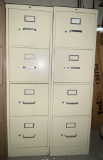 Two 4 drawer metal filing cabinets