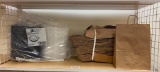 Stack of Brown Paper Bags with Handles, and to-go clamshell Containers