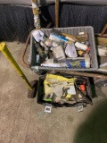 Two bins of miscellaneous tools and a sledgehammer