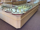 L-Shaped Lighted Counter Display with Lower Cabinets and Drawers