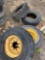 (4) Skidloader wheels and tires.