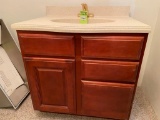 Aristocraft Bathroom Cabinet Vanity with a Swanstone Countertop with...Sink and Brass Faucet