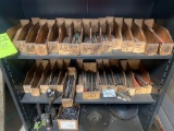 Metal shelf loaded with reamers of all sizes and more. see pics