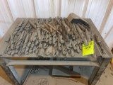 Group of drill bits on metal stand