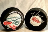 Hey Hey Hockey Town! 2 x NHL Hockey Pucks - One signed by Legendary Detroit Red Wing Steve Yzerman!
