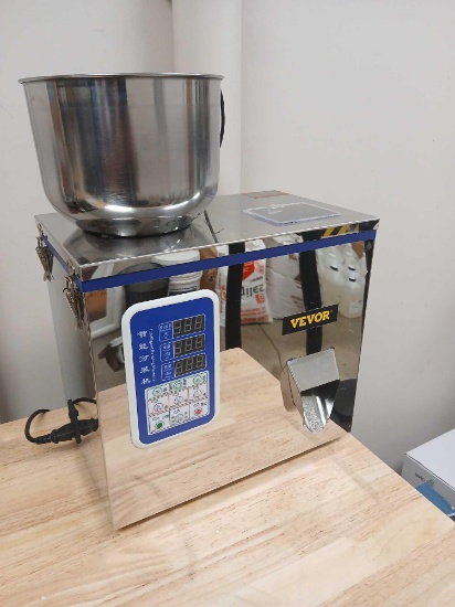 Automatic Powder and Particle Weighing Filling Machine.