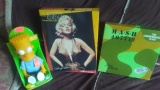 M.A.S.H. Commemorative Plate, Marilyn Monroe Puzzle, and Dan-Dee Bart Simpson Doll