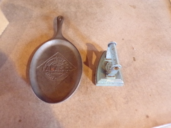 Lot of 2 /1 cast skillet and 1 sad iron decorated