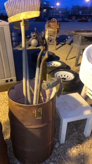 Barrel with shovels, joe, rake, sledge, Axe