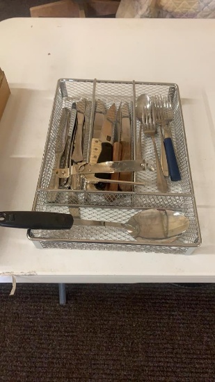 Lot of knives,forks,can opener,spoon & holder