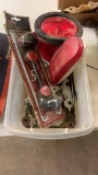 Box of misc tail lights,wrenches,battery hold-down