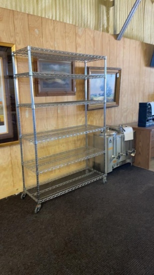 Rolling metal shelf unit