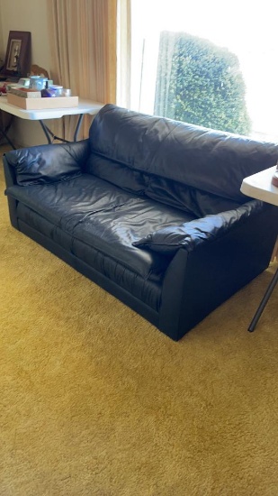 Blue leather loveseat