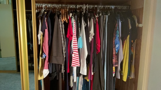 Lot of assorted women’s clothes.