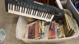 Tub of misc vinyl records, books & keyboard
