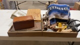 2 boxes of throw blanket,figurines & cigar boxes