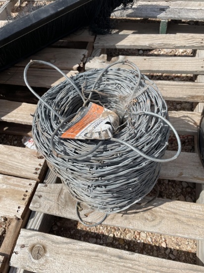 New roll of 12-1/2ga barbed wire