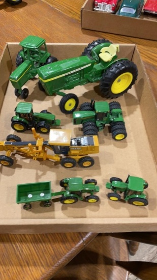 Box of JD toy tractors