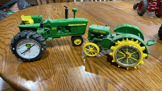 2 John Deere clock tractors