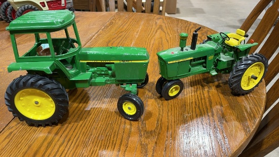 2 John Deere metal tractors