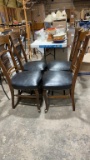 4 leather covered chairs