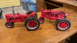 2 Farmall metal tractors