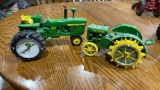 2 John Deere clock tractors