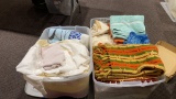 2 tubs of towels,sheets,blankets & afghans