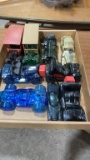 Box of vintage Avon car cologne bottles