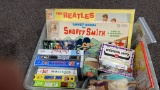 Box of vintage games, VHS tapes,Aladdin dolls,