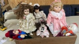 Lot of misc dolls in wood box
