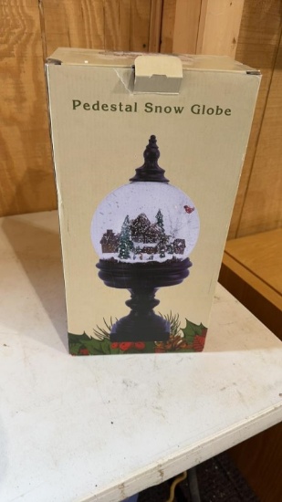 Pedestal snow globe