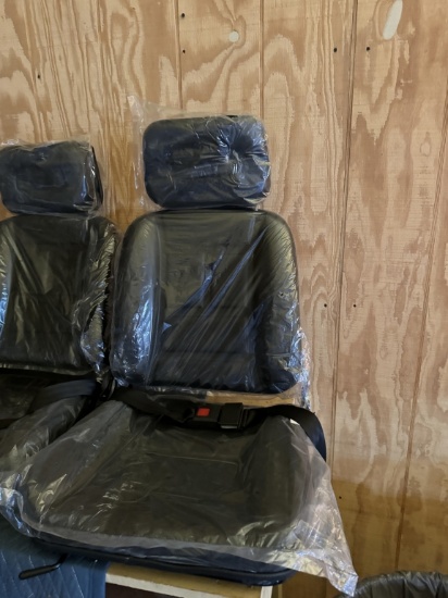Equipment seat with head rest